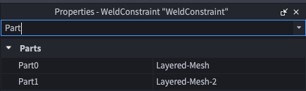 The WeldConstraint properties with Part0 set to the first layered mesh and Part1 set to the second.