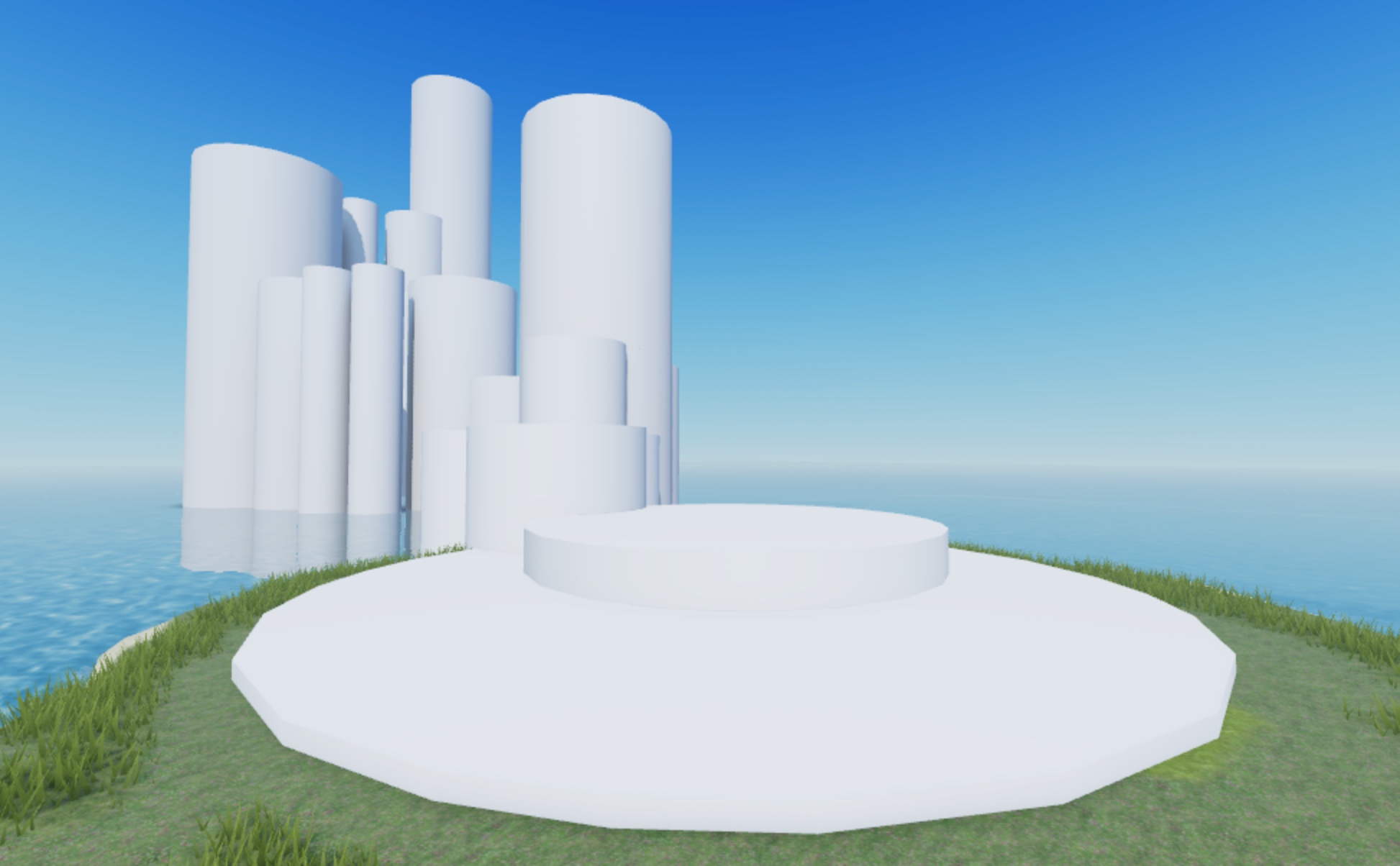 Many large cylinder objects partially sticking out of an island surrounded by water, and the water itself.