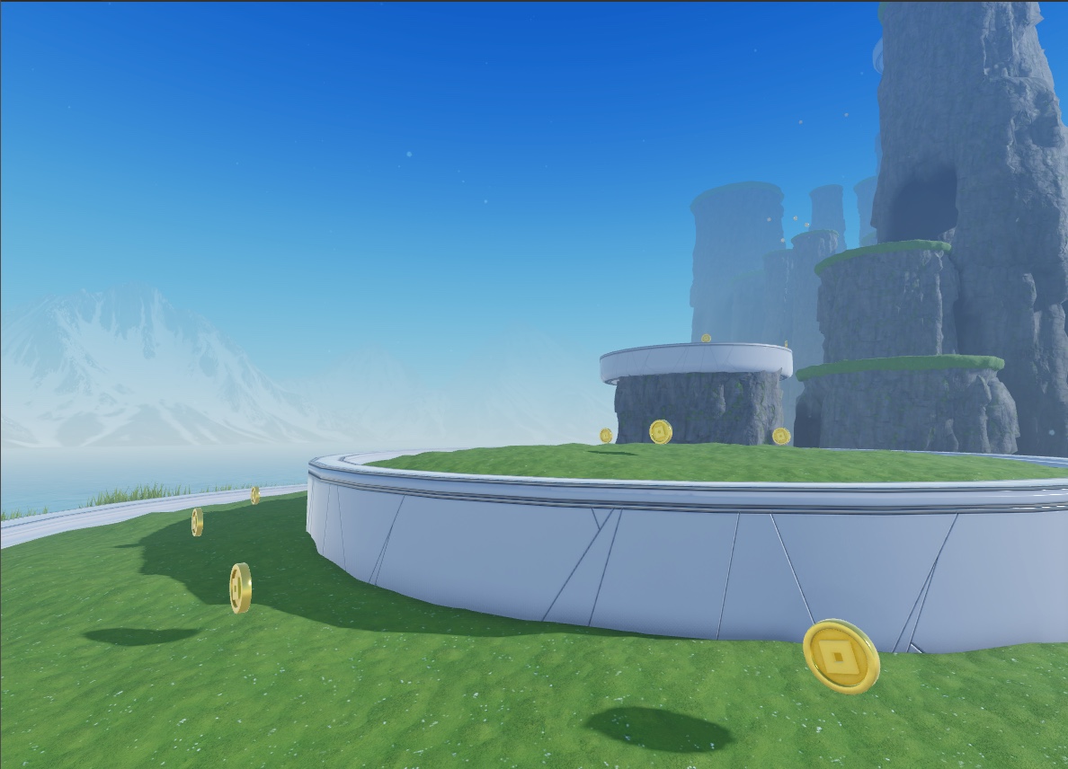 A view of the polished sea stacks, platform, and coins, with a mountain range in the background.