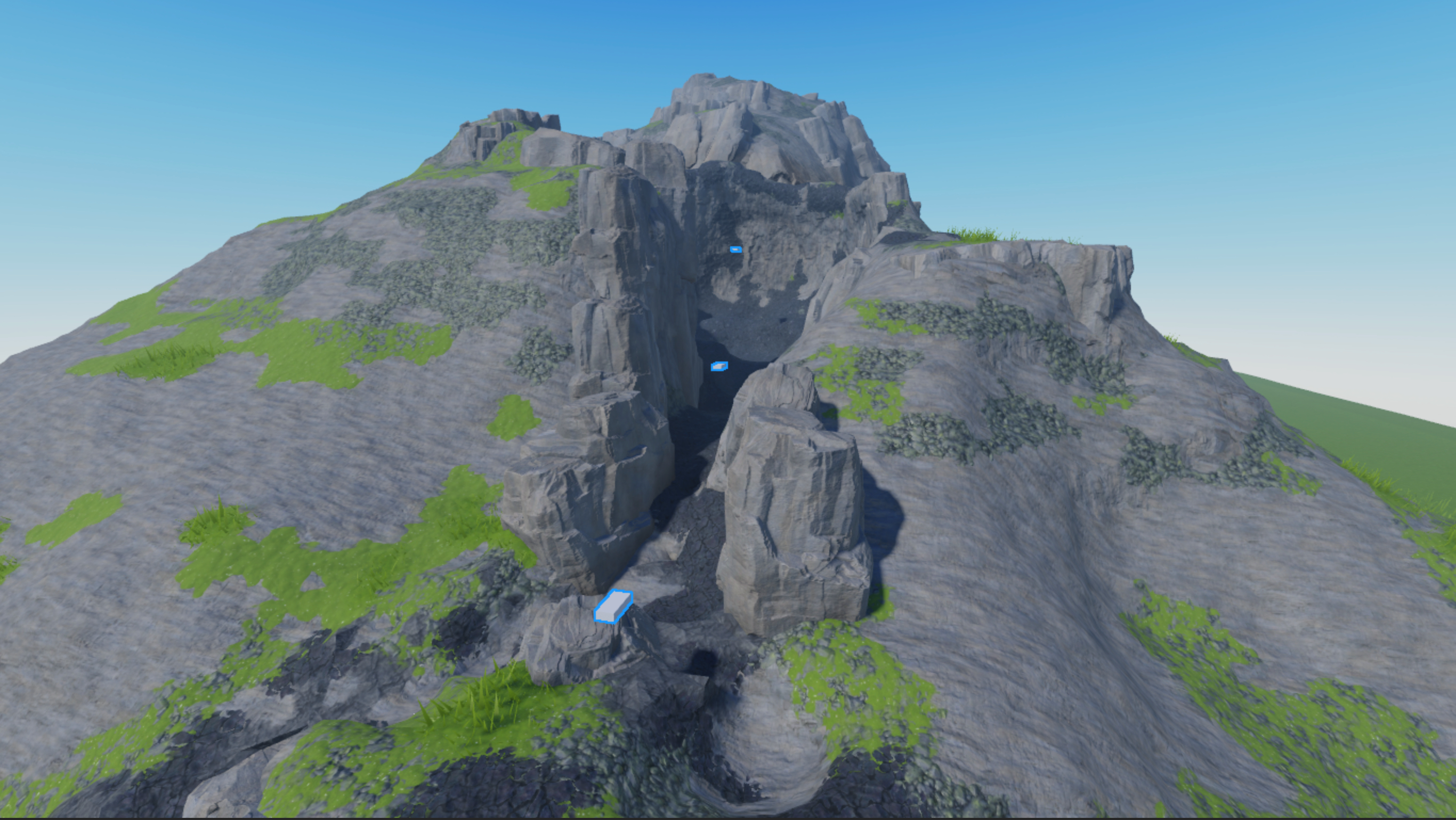 A front view of the volcano with three block parts positioned throughout the volcano's valley.