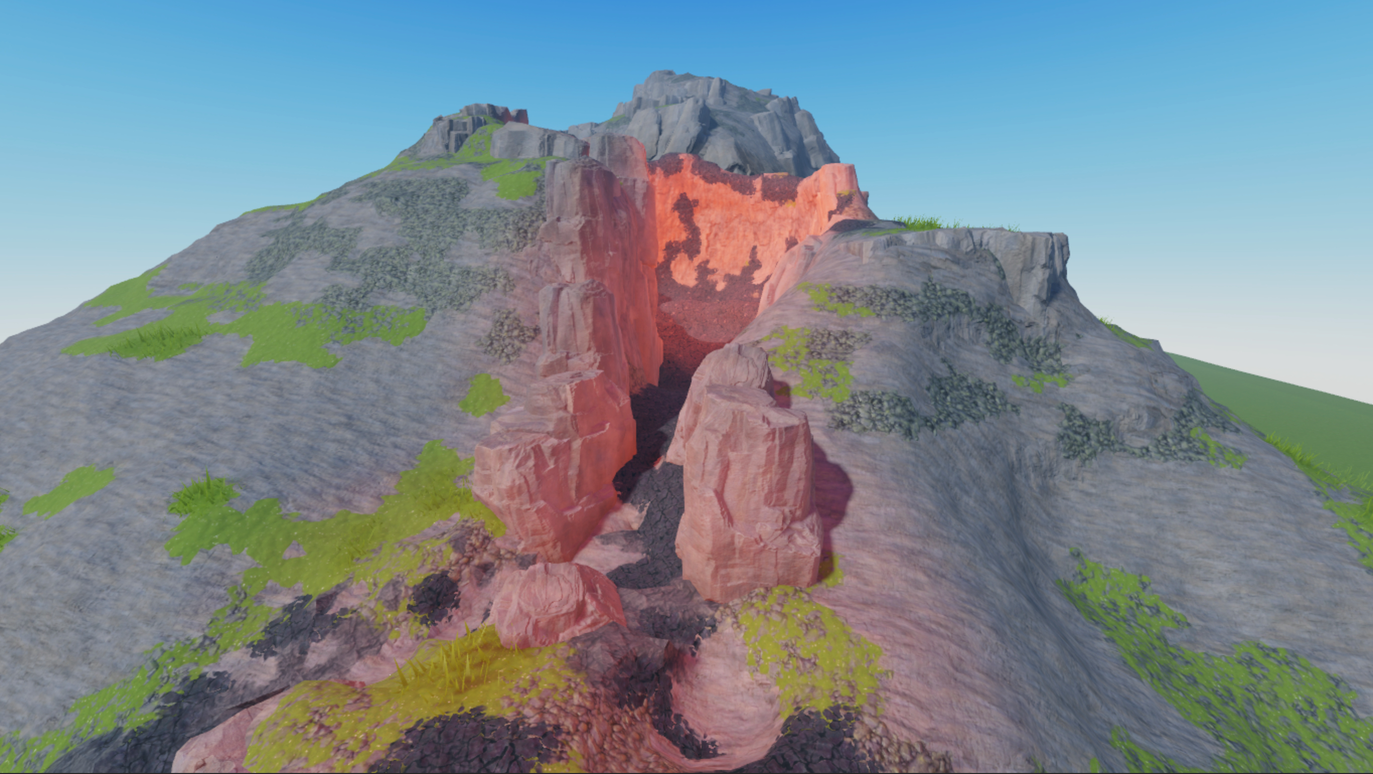 A front view of the volcano that has orange lighting throughout the volcano's valley.