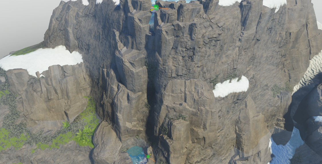An angled side view of the cliff with two block parts that include attachements. The block part at the top of the cliff includes a yellow visual aid that points away from the cliff, and the block part at the bottom of the cliff includes a yellow visual aid that points toward the cliff.