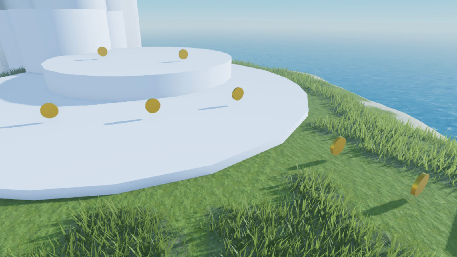 A view of multiple coins on the island and two gray cylinder sea stacks.